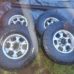 16x8 8 lug wheels w tires