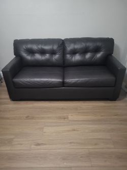 Brown leather sofa sleeper