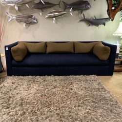 Long Blue Sofa with Brown Cushions