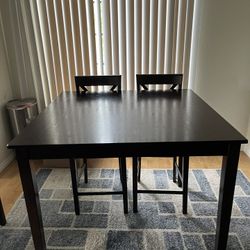Dark Wood Height Dining Table With Two Chairs