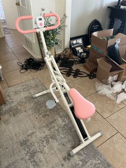 Pink and White Squat exercise machine