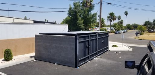 Trash dumpster roof enclosure