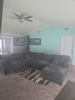 Extra large , high quality charcoal gray couch with accessory pillows