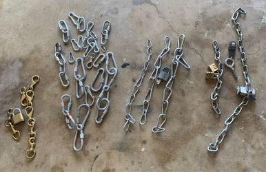 A collection set of hardware including stainless steel chains and carabiner clips often used for gate latches, trailers, or securing items.