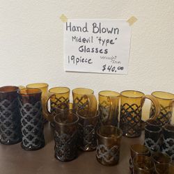 Hand Blown Mid Evil type Glasses, Caged In iron.  Amber Color.  Very Unique.  