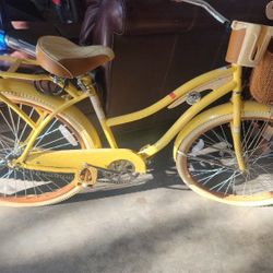 Shwinn yellow beach cruiser