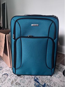 Green American Tourister carryon roller bag