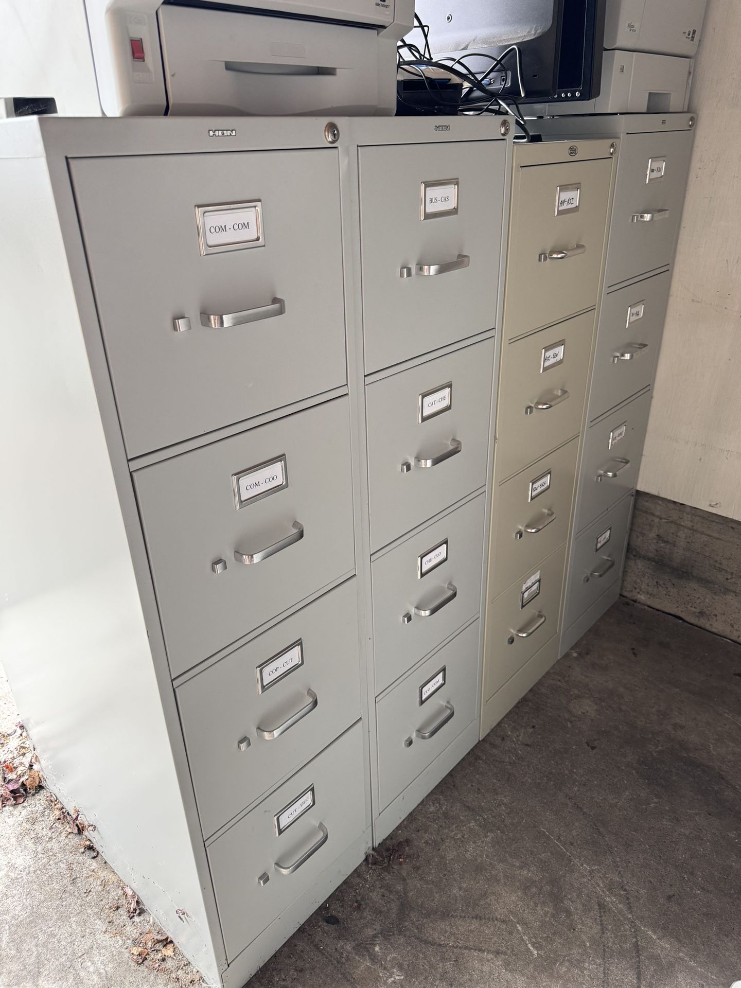 16 Four drawer Filing Cabinets 