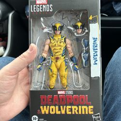 Deadpool & Wolverine Wolverine battle damaged action figure in hand