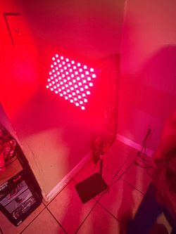 red light therapy panel on an adjustable floor stand