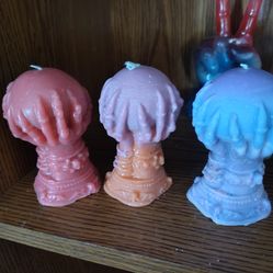 Witch hands holding crystal ball candle homemade