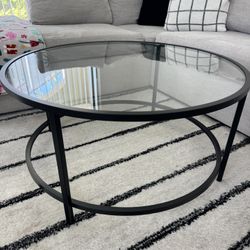 Round glass top coffee table