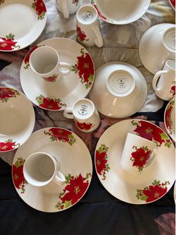 Beautiful lot of Christmas Poinsettia dishes by Gibson Home