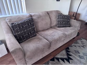Beige couch and loveseat