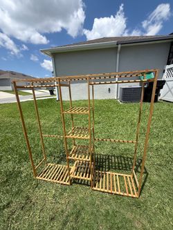 Selling a large wooden clothes organizer.