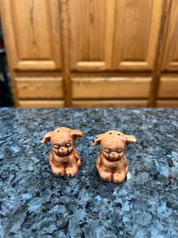 Ceramic Vintage Cute  Dog Pair of Salt and Pepper Shakers.  Size approximately 1 1/2 inches tall.  Preowned missing stoppers.