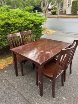 Wooden table and four chairs