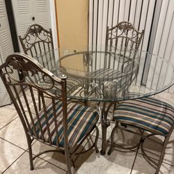 Glass round table with matching chairs