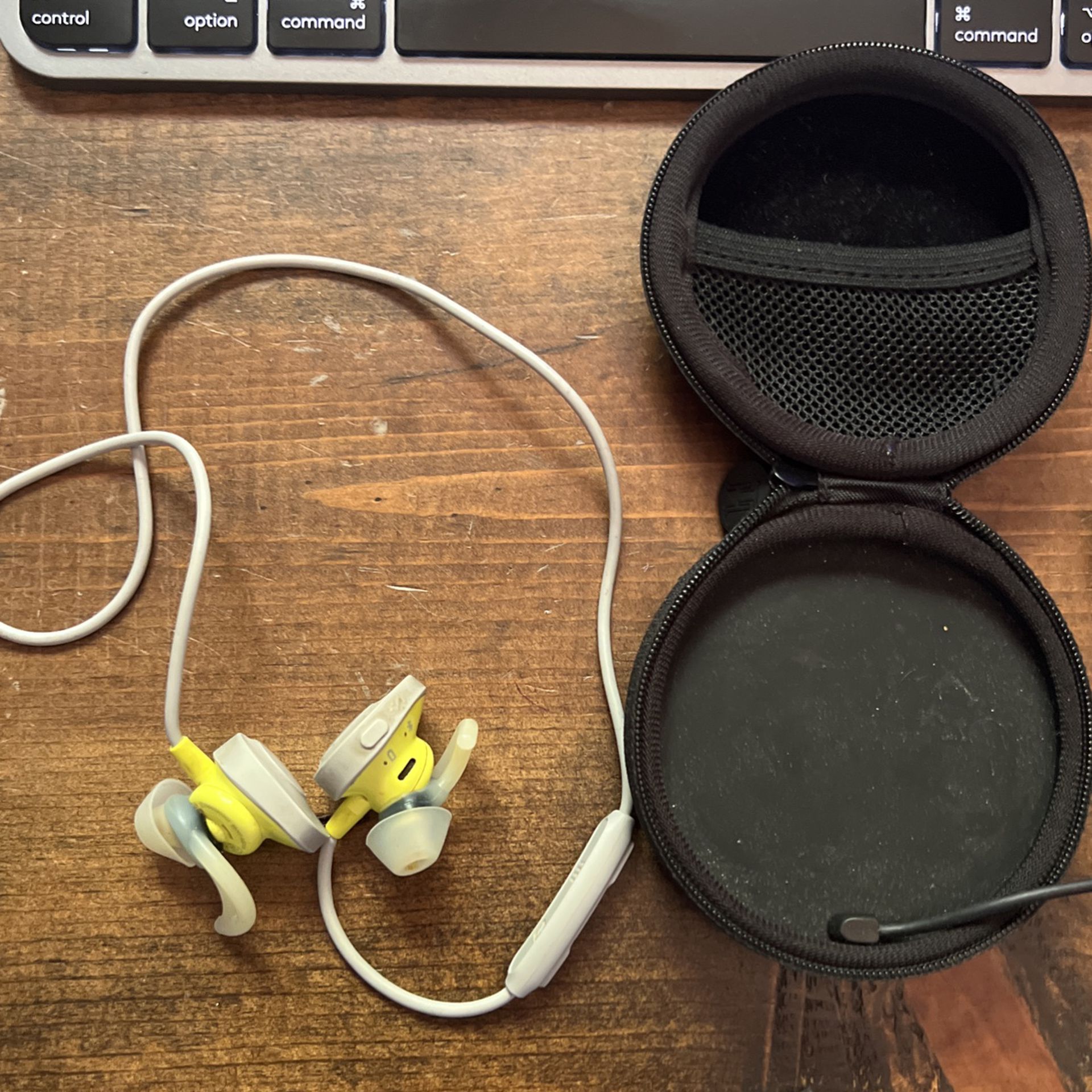 Bose running headphones and charging case