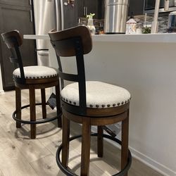 2 Very comfortable upholstered swivel bar stools 