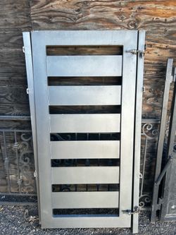 Silver painted metal privacy gate