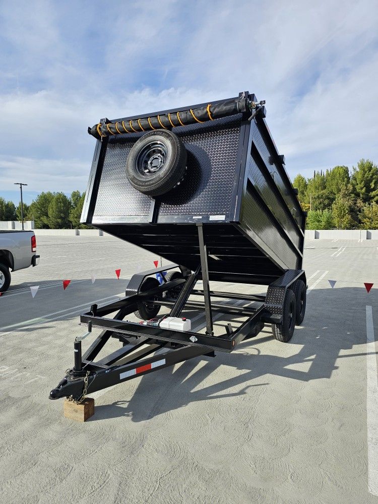 NEW DUMP TRAILER 8X12X4 12000 LBS
ROLLING TARP--SPARE TIRE,ELECTRIC BRAKES,HYDRAULIC SYSTEM,REMOTE CONTROL,IDEAL FOR HAULING, DEMOLITION, TRASH ETC,