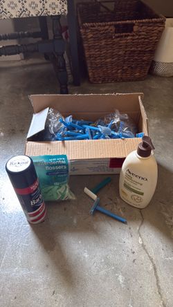 Toiletries, 75 single use razors, body lotion, shaving cream, and flossers