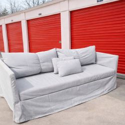 Gray sofa in good condition with cushions included.