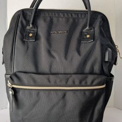 KROSER Laptop Backpack, specifically designed to fit laptops up to 17 inches and featuring a built-in USB port for charging devices. 