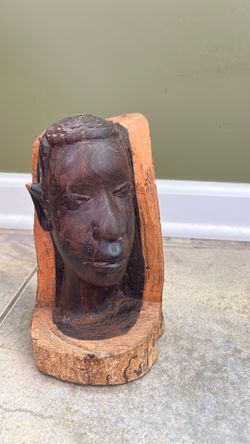 Wood carved bust of African man’s head