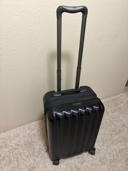 Carry On luggage black roller charger inside