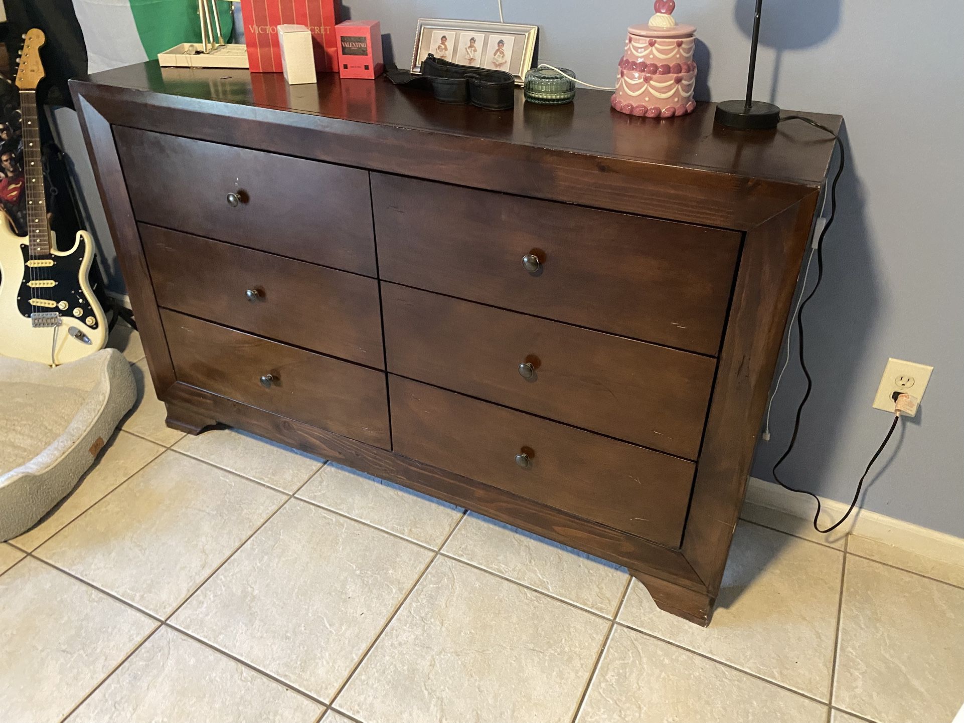 Brown wood dresser and nightstand