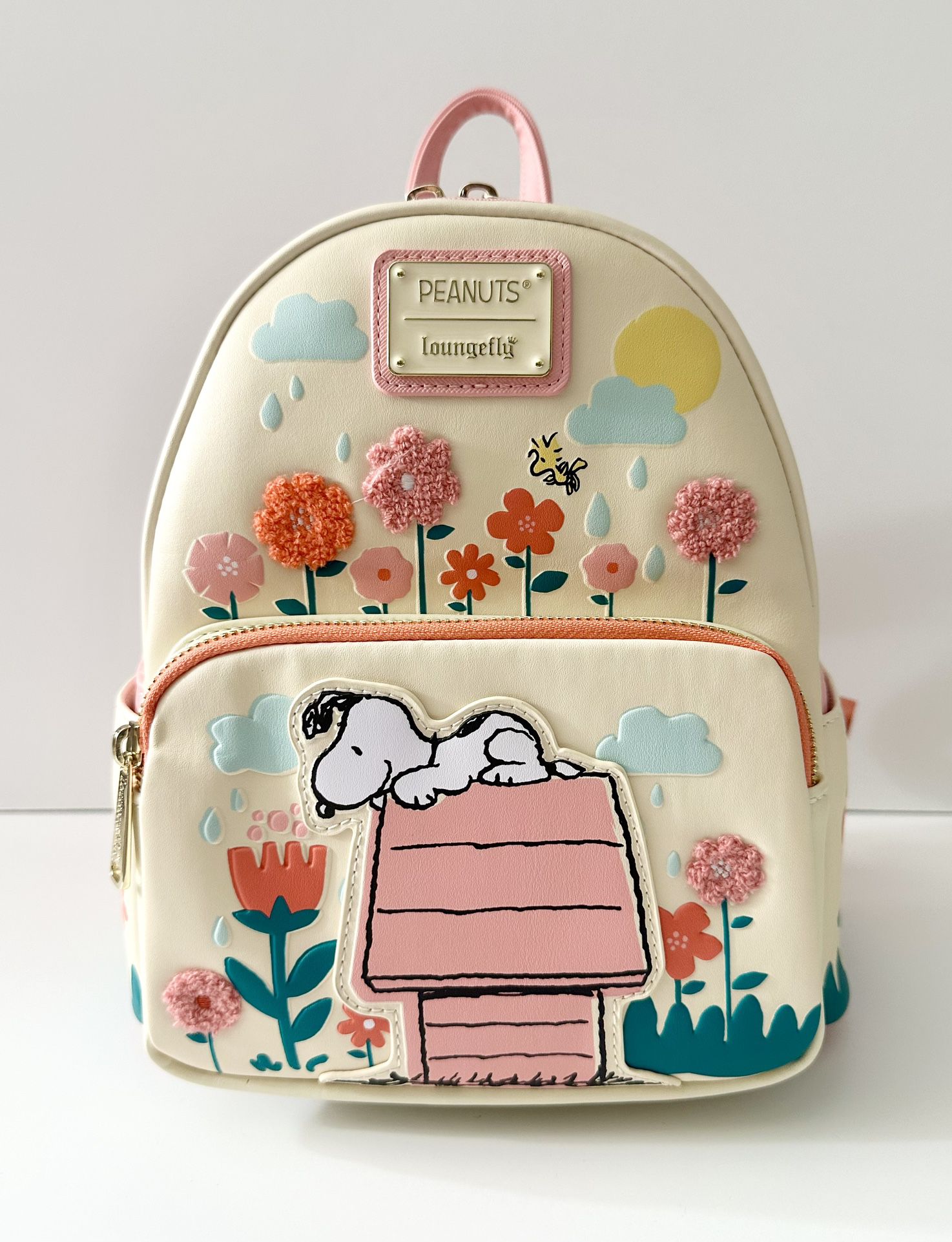 BRAND NEW WITH TAGS PEANUTS SNOOPY DOGHOUSE FLORAL LOUNGEFLY MINI BACKPACK FOR SALE. 