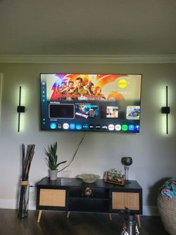 Samsung sixty five inch t v with wall mounts included