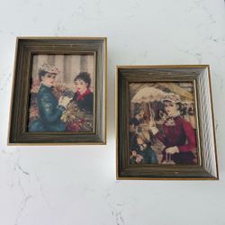 Set of two Cherry Jeffe Huldah prints in 9 1/2” x 8” wood frames with glass . Parisian flower market ladies and parasol lady