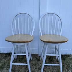 Two wood swivel counter height bar stools