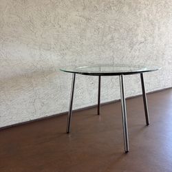 One Round Glass And Metal Dining Table