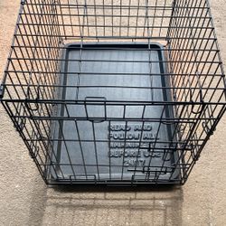 Metal dog crate. See pictures for measurements and plastic tray that’s removable.