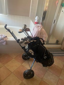 Golf clubs and rolling stroller