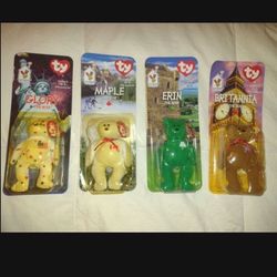 Set of 4 TY Beanie Babies Glory,  Erin,  Britannia, And  Maple the Bear McDonalds 1999. New, unopened, plastic packing is yellowed.