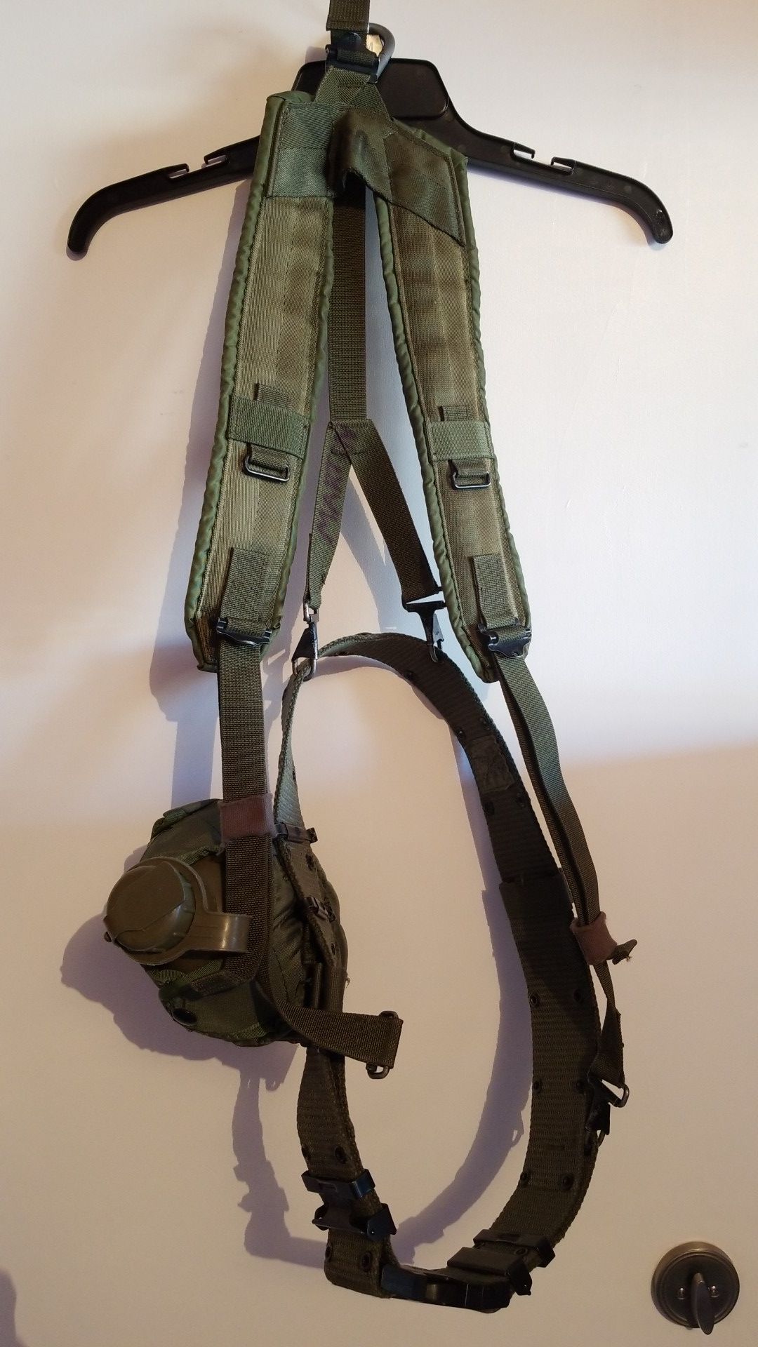 Military web belt and shoulder harness.