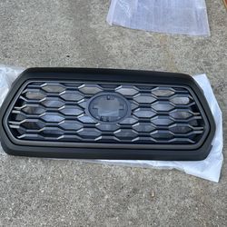 Toyota Tacoma grill, Parilla, Corasa 16-23 ( new truck parts )