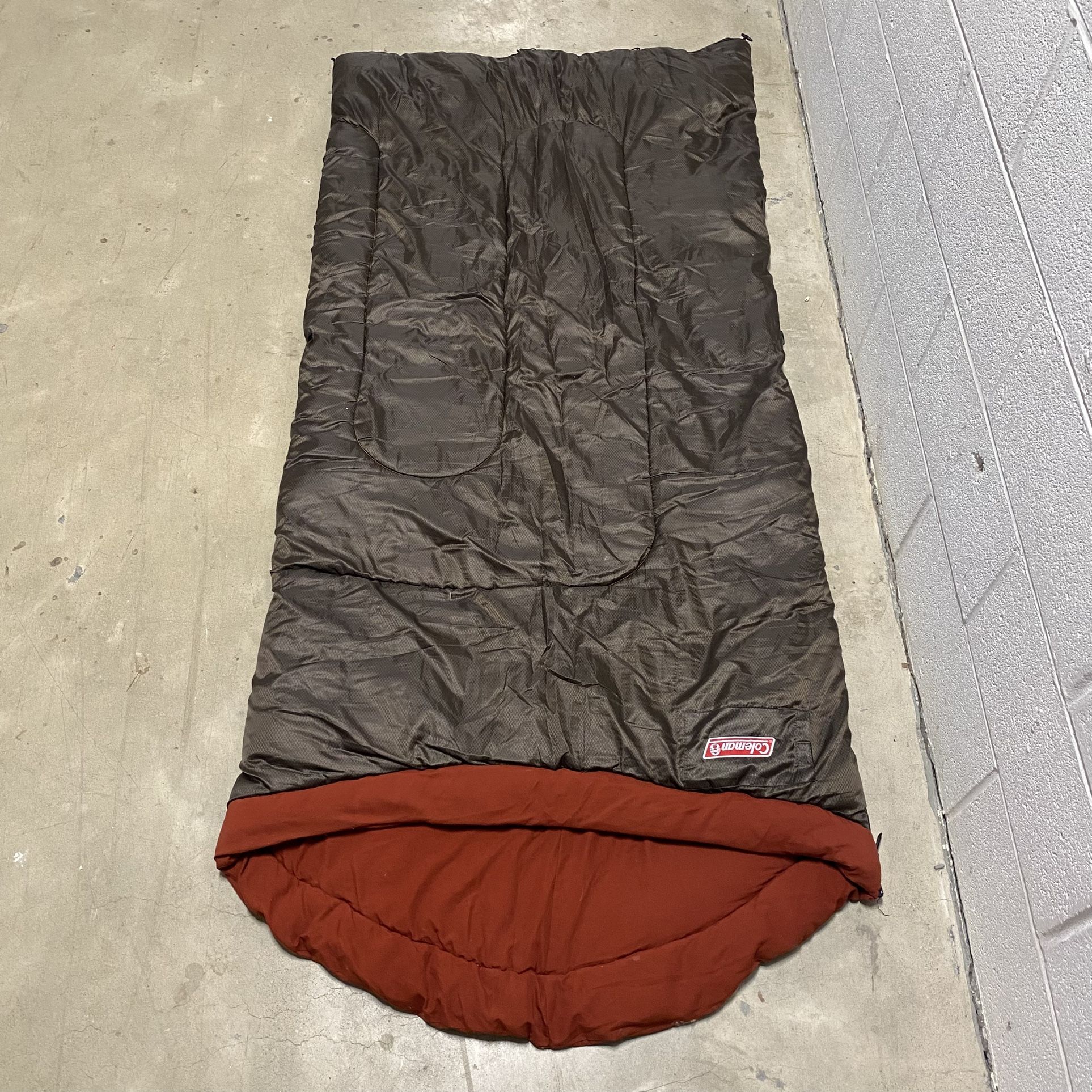COLEMAN SLEEPING BAG CAMPING GEAR 6’x32" Brown with Red Orange Lining  Great pre-owned condition.   Pick up available in Arlington VA by the Sheraton 