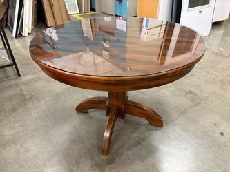 Dark Finished Round-to-Oval Extendable Dining Table with Interior Leaf and Glass Top