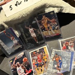Michael Jordan, Patrick Hugh, Charles Barkley, Jerry West, straight out the pack in the plastic from my hand of your hand