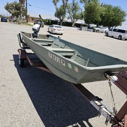 Jon Boat With 75 Evinrude Motor And Trailer