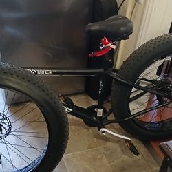 Nearly New 26" x4" tires, Mongoose MALUS  MOUNTAIN  BIKE. Black With Cushioned Seat.  $519.99  Out The Box