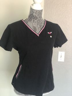 Koi scrub top size Medium with black with pink and white print on side pockets