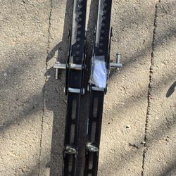 Pair of TV mounting rails from a universal wall mount.
Fits most flat-screen TVs with VESA mounting holes.
Hardware included.