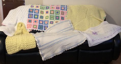 New crocheted baby quilts and clothing